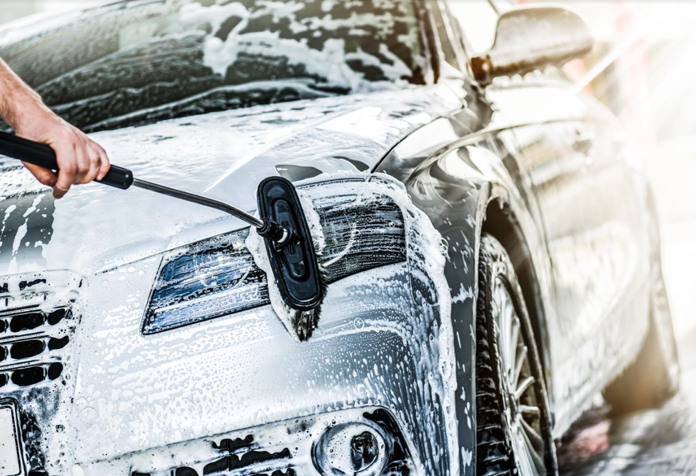 Guy Using a Car Wash Brush